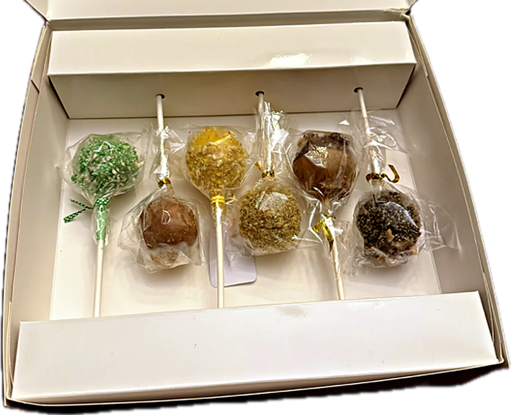Cake Pop Gift Box, Open An open Miss Confection gift box holding six cake pops, each sealed in its own bag and laid side by side