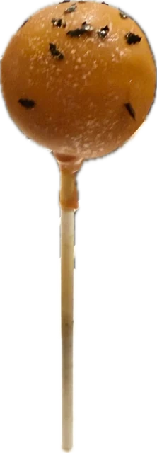 Halloween cake pop in a smooth orange shell with black flecks, black velvet cake inside