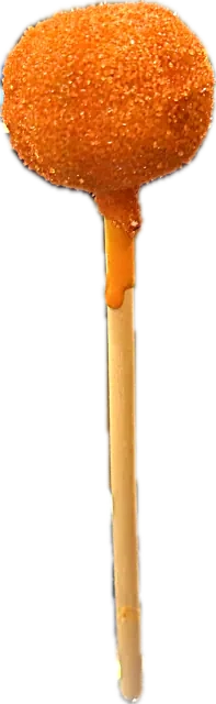 Halloween cake pop rolled in sparkling orange sugar, black velvet cake inside