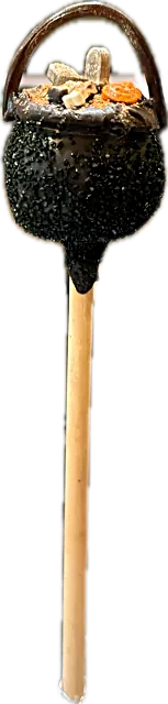 Halloween cauldron cake pop in sparkling black sugar with a licorice handle, black velvet cake inside